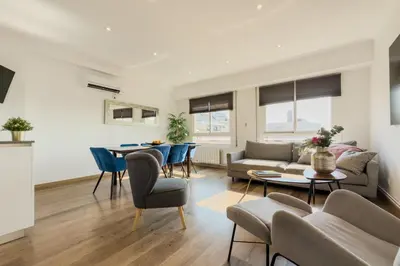 a living room with a couch and a table at Penthouse City Center With 2 Terraces And Views in Barcelona