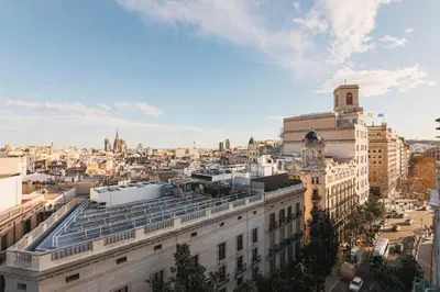 a view of the city from the roof of a building at Penthouse City Center With 2 Terraces And Views in Barcelona