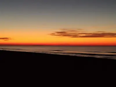 a sunset on a beach with the ocean at VILLA BELLA ESTANÇA in Castelldefels