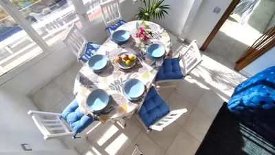 an overhead view of a dining room table with chairs at CATALINA PORT & BEACH -3 dormitorios in Masnou