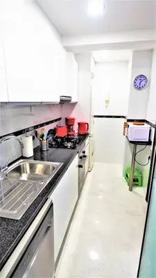 a kitchen with a sink and a counter top at CATALINA PORT & BEACH -3 dormitorios in Masnou