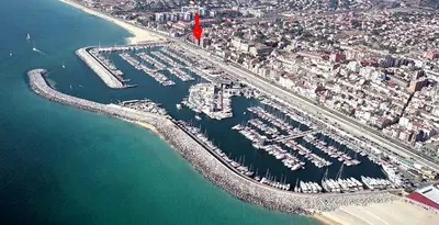 an aerial view of a marina with boats in the water at CATALINA PORT & BEACH -3 dormitorios in Masnou