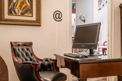 a computer sitting on a desk with a chair at Hotel Medium Romantic in Sitges