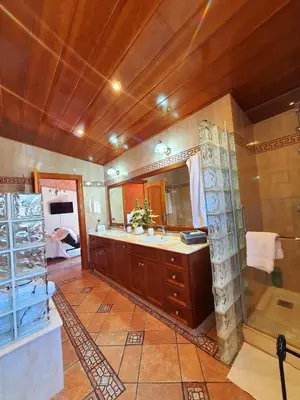 a large bathroom with a sink and a shower at Raco de Lis in La Torre de Claramunt