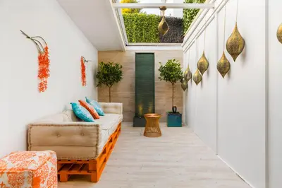 a living room with a couch and a skylight at Antonio's House in Sitges