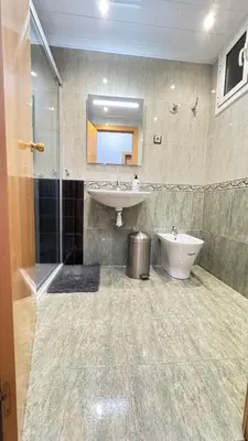 a bathroom with a sink and a toilet at Pensión Laforja in Barcelona