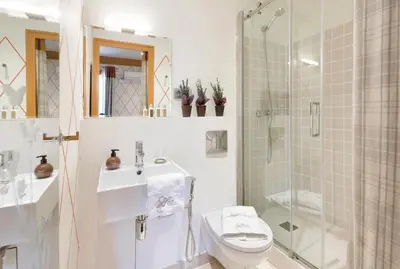 a bathroom with a shower and a toilet and a sink at HoHomes - Centric Design Apartment in Barcelona
