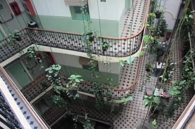 an overhead view of a balcony with potted plants at Hotel Peninsular in Barcelona