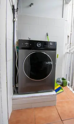 a microwave sitting on a shelf in a kitchen at Apartament Sagrada Familia in Barcelona