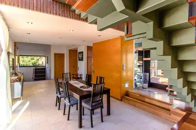 a dining room with a table and chairs at Catalunya Casas Stunning modern villa and just half hour to Barcelona! in Caldes de Montbui