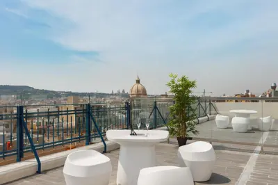 a balcony with a toilet on top of a building at Dorma Plaza Catalunya in Barcelona