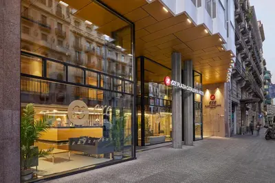 a store front of a building with a red traffic light at Dorma Plaza Catalunya in Barcelona