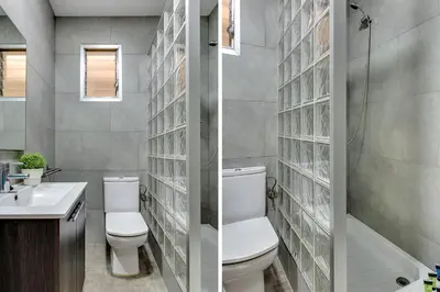 a bathroom with a toilet and a sink at Renovated & Classic 3-Bedroom Sagrada Familia Apartment in Barcelona