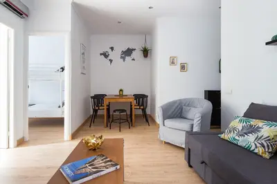 a living room with a couch and a table at Lovely and Convenient Sagrada Familia Apartment in Barcelona