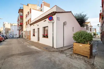 a white building on the side of a street at CASA FLAMINGO in Masnou