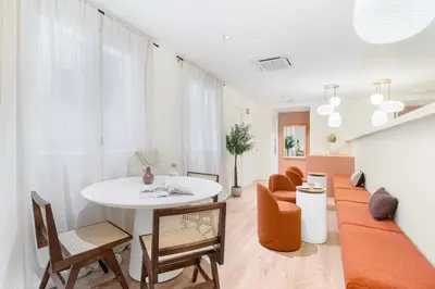 a living room with a white table and chairs at LeMar by Aspasios in Barcelona
