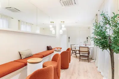 a living room with a couch and chairs and a table at LeMar by Aspasios in Barcelona