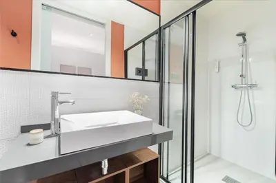 a bathroom with a sink and a shower at LeMar by Aspasios in Barcelona
