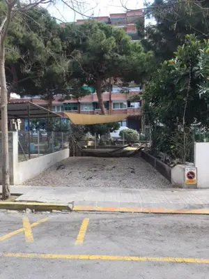 a large amount of sand in a parking lot at Apartament Can Mateu-Gran Terraza in Vilassar de Mar