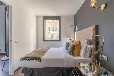 a bedroom with a bed and a window at TSA La Rosa in Barcelona