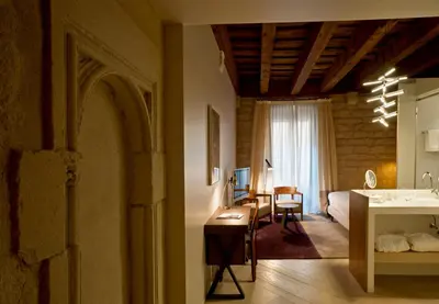 a bathroom with a shower and a sink and a mirror at Mercer Hotel Barcelona in Barcelona