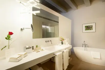 a bunch of lights hanging from a mirror at Mercer Hotel Barcelona in Barcelona