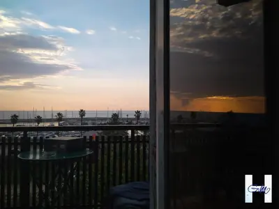 a view of the ocean from a balcony at Hostal Santa Gemma in Sant Vicenç de Montalt