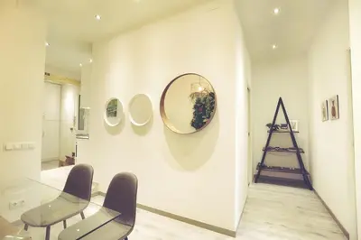 a room with chairs and a mirror on a wall at Dip2 in Barcelona