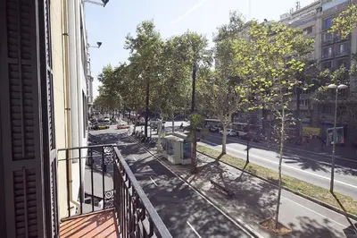a view of a street from a balcony of a building at You Stylish Diagonal Apartments in Barcelona