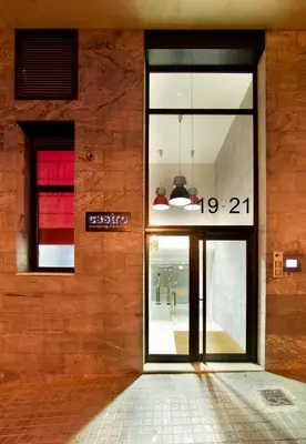 a store front with a glass door on a building at Castro Exclusive Residences Sant Pau in Barcelona