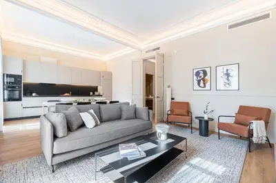 a living room with a couch and a table at Aspasios Rambla Catalunya Apartments in Barcelona