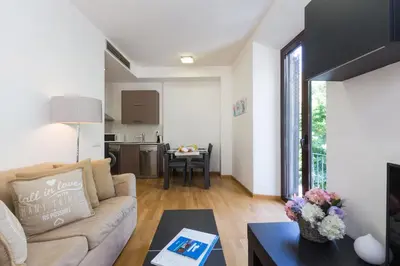 a living room with a couch and a table at Matarolux16 in Mataró