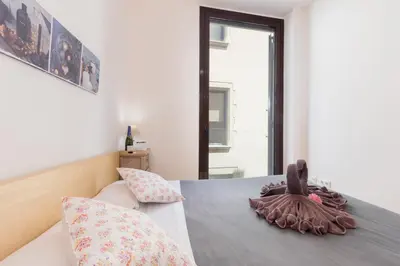a bedroom with a bed with two pillows on it at Matarolux16 in Mataró