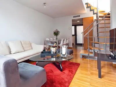 a living room with a couch and a table at My Space Barcelona Guell Terrace Center in Barcelona