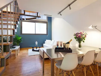 a living room with a table and chairs at My Space Barcelona Park Güell Apartments in Barcelona
