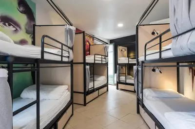 a group of bunk beds in a room at No Limit Hostel Graffiti in Barcelona