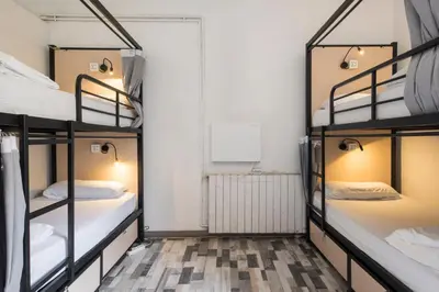 a couple of bunk beds in a room at No Limit Hostel Graffiti in Barcelona