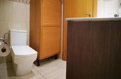 a bathroom with a toilet and a sink at White Stones Beach In Sant Pol de Mar in San Pol de Mar