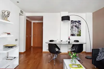 a dining area with a table and chairs in a room at AinB Sagrada Familia Apartments in Barcelona