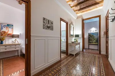 a hallway with a door leading to a bedroom at Habitat Apartments Grace in Barcelona