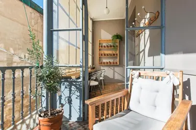 a balcony with a chair and a table at SibsBcn- Rambla- Family Friends Business Central in Barcelona