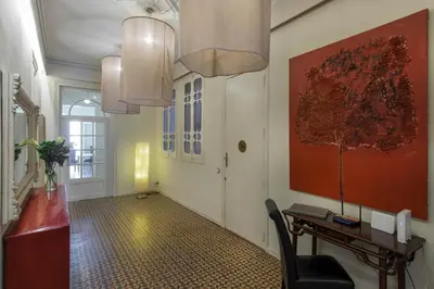 a hallway with a desk and a table in a room at SibsBcn- Rambla- Family Friends Business Central in Barcelona