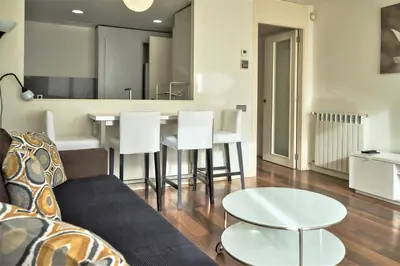 a living room with a couch and a table at Apartamento Via Augusta 153 in Barcelona