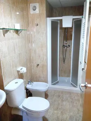 a bathroom with a shower and a toilet and a sink at Hostal Sant Sadurní in Sant Sadurní dʼAnoia