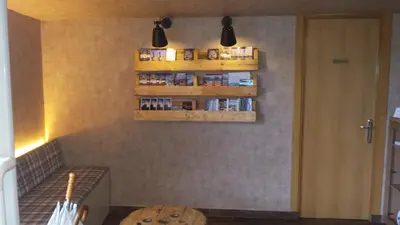 a kitchen with shelves on the wall and a table at Guilleumes Montserrat in Monistrol