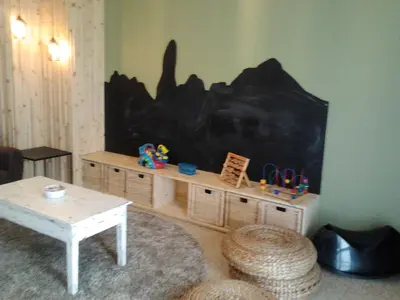a living room with a tv and a table at Guilleumes Montserrat in Monistrol