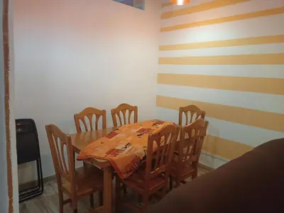 a dining room with a table and four chairs at Fira Plaza España Apartment 3ʳᵈ Floor Balcony in Barcelona