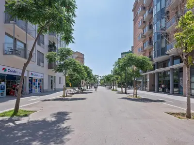 an empty street in a city with buildings at Citytrip Poble Nou Beach in Barcelona