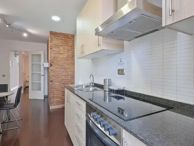 a kitchen with a sink and a counter top at Citytrip Poble Nou Beach in Barcelona