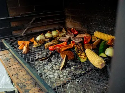 a bunch of vegetables are cooking on a grill at El Molí Blanc in Lavid